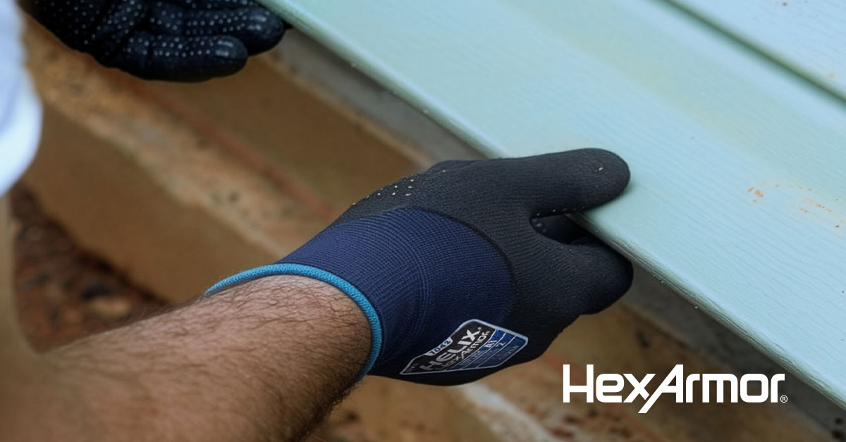 The Helix 1042 glove being used to grip siding.