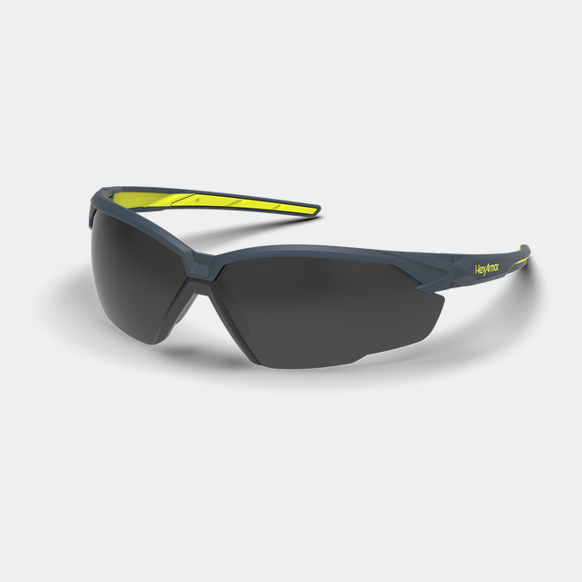 Grey and yellow NX1 weld shade safety glasses shown as they are sitting on a table.
