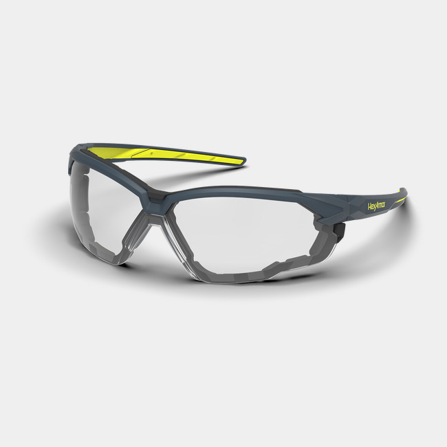 Grey and yellow NX1G anti-fog gasketed safety glasses shown as they are sitting on a table.
