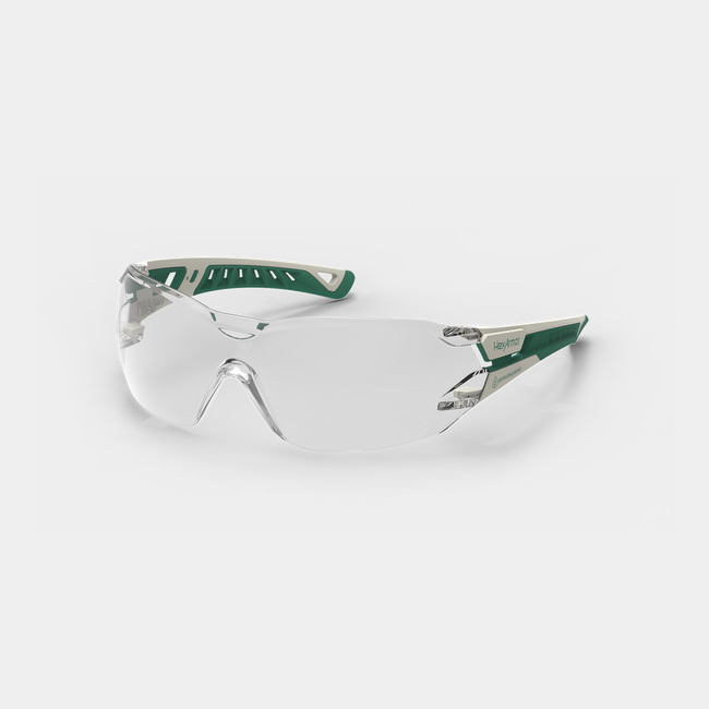 White and green MX225 planet series sustainable anti-fog safety glasses shown as they are sitting on a table.