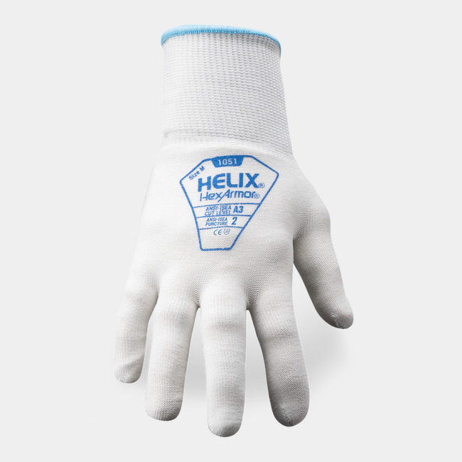 Back of hand view of Helix 1051 food safe gloves showcasing the glove label and HPPE/nylon blend shell.