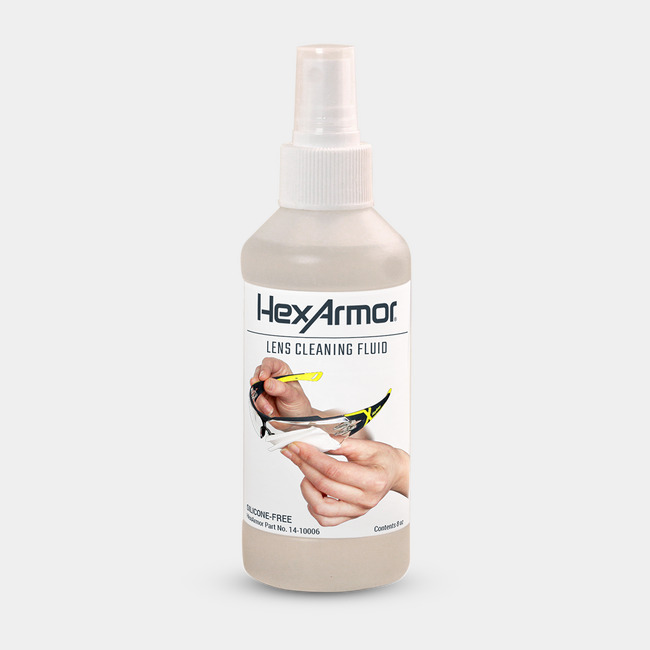 HexArmor lens cleaning fluid shown as sitting on a table.