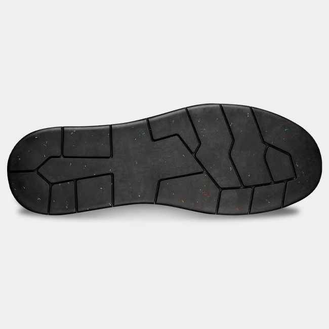 Bottom side of heat-resistant work boot showcasing the unique tread and MACSOLE rubber outsole.