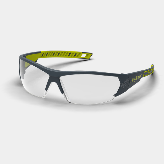 Grey and yellow MX250 anti-fog safety glasses shown as they are sitting on a table.